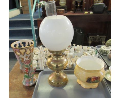 Three items: brass oil lamp with clear glass chimney and white glass shade, together with continental vase with relief china 