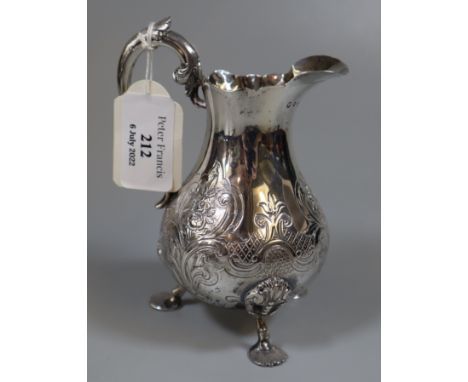 Victorian silver helmet shaped cream jug on shell design feet. Edinburgh 1868 5.2 troy ozs approx.  (B.P. 21% + VAT) 