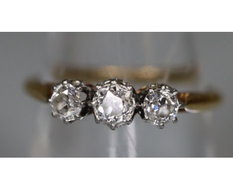 18ct gold diamond 3 stone dress ring. 2.7g approx size M. (B.P. 21% + VAT) Diamonds are, 2mmx1mm approx. 0.1 carat.  1mm x2 a