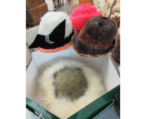 A collection of good quality vintage and designer hats in hat boxes, to include: a pheasant feather hat by Brights of Bristol