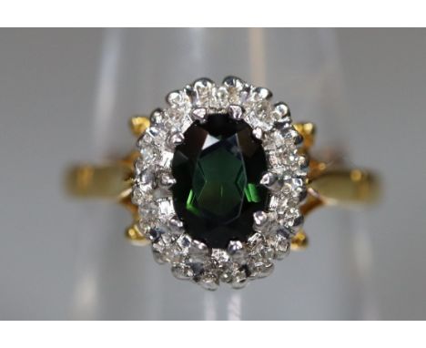 18ct gold Emerald/green and diamond dress ring. 4.3g approx size L ((B.P. 21% + VAT)Good condition, stone size 7mm x 8mm appr