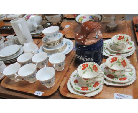 Two trays of assorted china to include: three Wedgwood Trios and a matching plate in the 'Poppy' design, a Tetley's  Tea Man 