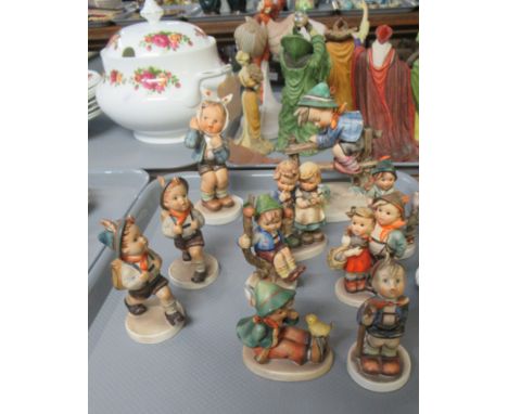 Tray of West Germany Goebel figurines of children to include, German boys in traditional dress, boy on a fence looking at a f