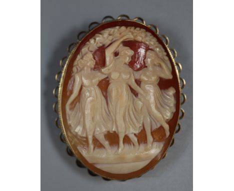 Large yellow metal carved portrait cameo brooch, 'The Three Graces'.  Associated case.  (B.P. 21% + VAT) 