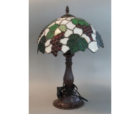 Modern Tiffany style table lamp, the shade overall with leaf and berry decoration.  (B.P. 21% + VAT) 