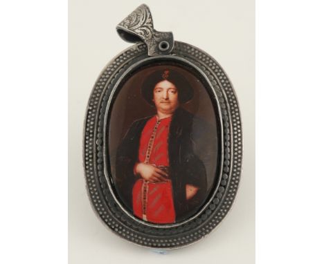 Continental School 20th Century Portrait miniature of a gentleman, in oriental dress Oval, enamel over printed base, in a whi