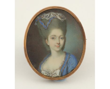 λFrench School 18th Century Portrait miniature of a young lady, wearing a blue dress, and lace cap with blue ribbon Oval, in 