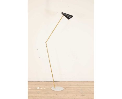 An Italian floor lamp, attributed to Stilnovo, with a black enamelled shade, on an adjustable brass column, raised on a circu