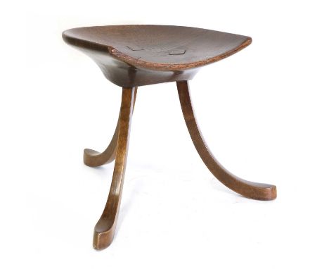 A Liberty &amp; Co. 'Thebes II' oak stool,c.1900, designed by Leonard Wyburd for Liberty &amp; Co., with a 'D' shaped seat ra