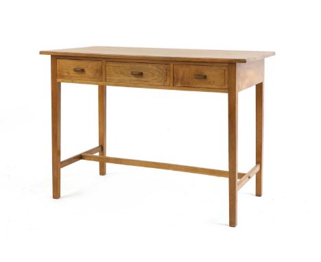 Peter Waals (Dutch, 1870-1937),a walnut side table, with a moulded top, three frieze drawers with 'D' shaped handles, and tap