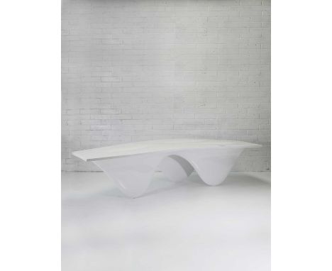 ▴ Zaha Hadid (1950-2016),a white 'Aqua' table, 2006, polyurethane resin and silicone, made by Established and Sons, signed in