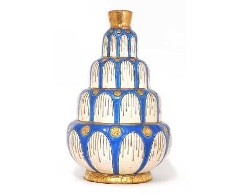 A Longwy pottery 'fountain' vase,of stepped form with gilt and blue enamels, printed marks and numbered 'D5220',26.5cm highCo