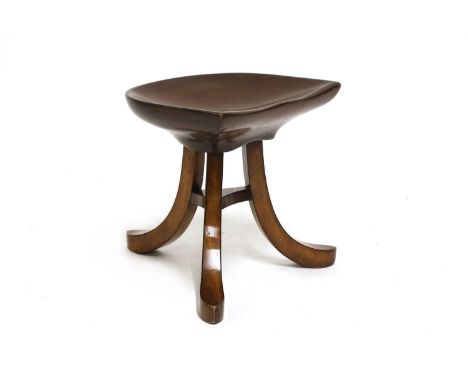 A Liberty &amp; Co. 'Thebes II' oak stool,c.1900-10, designed by Leonard Wyburd for Liberty &amp; Co., with a 'D' shaped seat