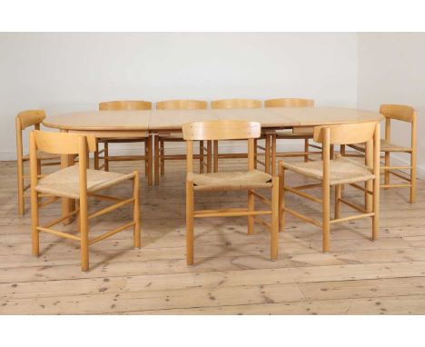 A Danish dining table and nine chairs, designed by Børge Mogensen, comprising:a dining table,with two extra leaves, 150cm wid