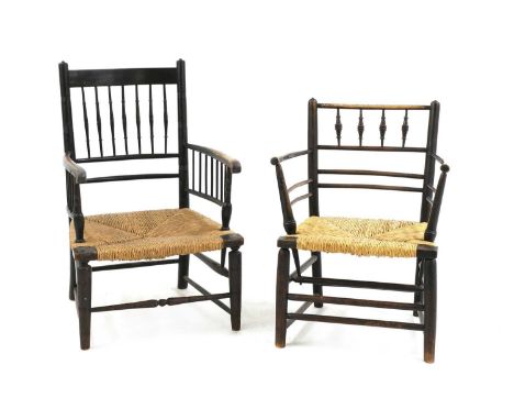 Two ebonised oak 'Sussex' armchairs,one example designed by Philip Webb for Morris &amp; Co., the other attributed to Philip 