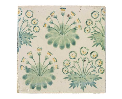 A Morris &amp; Co. 'Daisy' tile, designed by William Morris, painted in green with yellow details, inscribed 'No.9' and with 