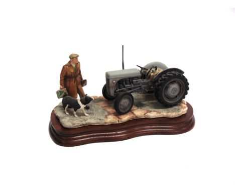 A BORDER FINE ARTS TRACTOR GROUP 'Early Start', model number JH91B, impressed marks to the base, on a shaped wooden plinth 