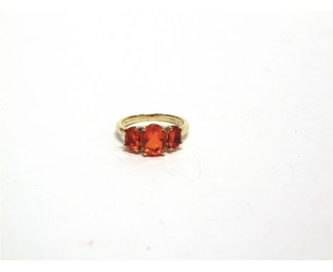 A THREE STONE FIRE OPAL 9 CARAT GOLD RING finger size L1/2, 2.5g gross 