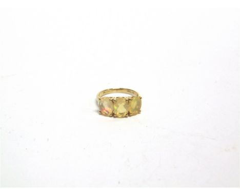 A THREE STONE OPAL 9 CARAT GOLD RING finger size L, 2.3g gross