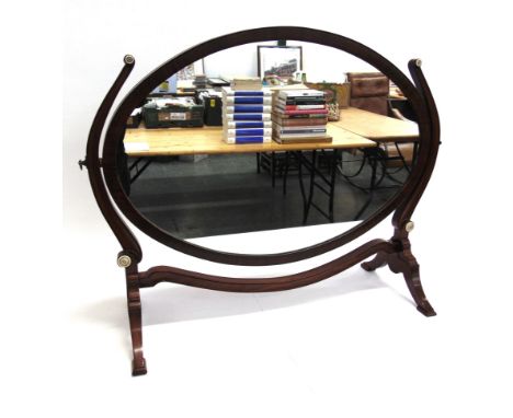 AN EDWARDIAN MAHOGANY OVAL TOILET MIRROR  73.5cm wide.