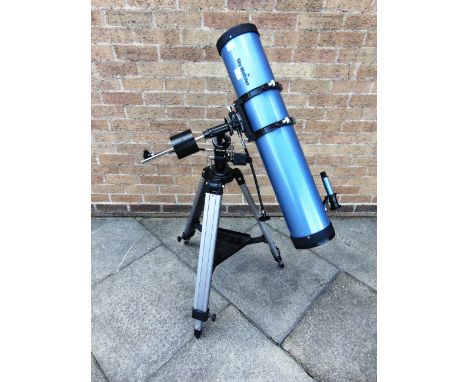 A SKY WATCHER TELESCOPE  with lenses and a tripod stand.