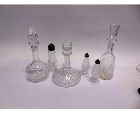 WATERFORD CRYSTAL:  two decanters and stoppers 34cm high, a sugar caster and a matching salt and pepper, all acid etched 'Wat