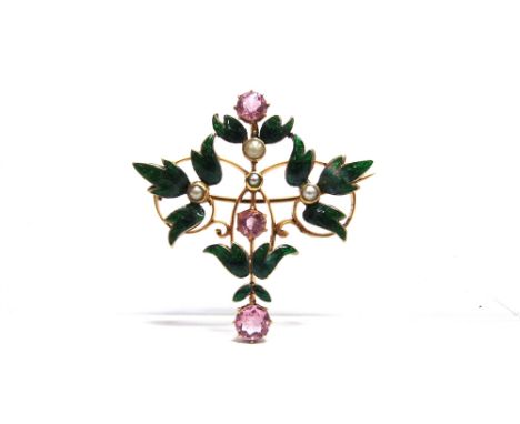 A PINK TOURMALINE, SEED PEARL AND GREEN ENAMEL BROOCH circa 1900, with sprays of green leaves at the compass points, 3.9cm ac