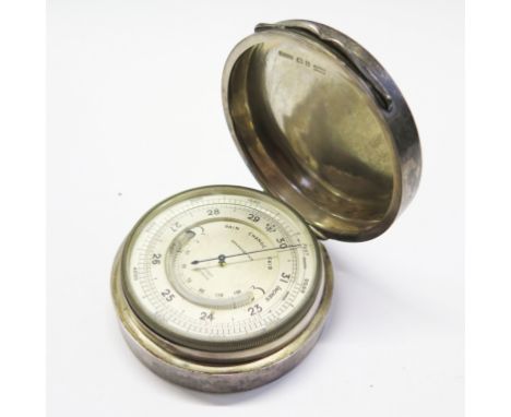 A large silver 'smiling face' barometer by Asprey London 