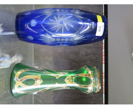 A Bohemian cobalt blue cut glass vase together with an Art Nouveau green glass vase with gilt and cabochon decoration