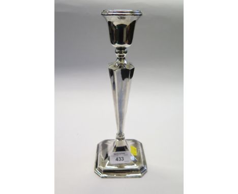 A silver candlestick, Birmingham 1925, 25.5cm high