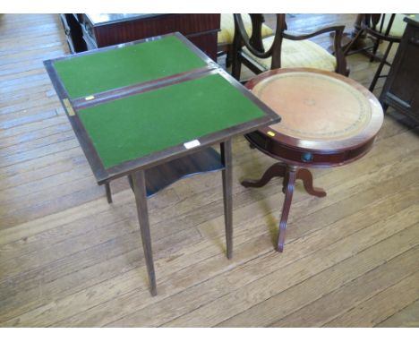 *A small mahogany foldover card table with undershelf and square tapering legs, 52cm, and a reproduction drum table