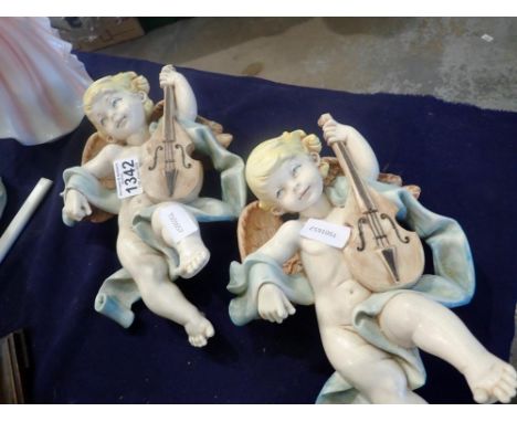 Pair of cello playing cherubs, H: 27cm. UK P&amp;P Group 3 (£30+VAT for the first lot and £8+VAT for subsequent lots)
