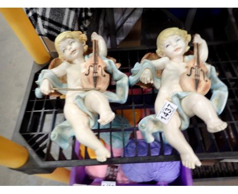 Pair of cello playing cherubs, H: 27cm. UK P&amp;P Group 3 (£30+VAT for the first lot and £8+VAT for subsequent lots)