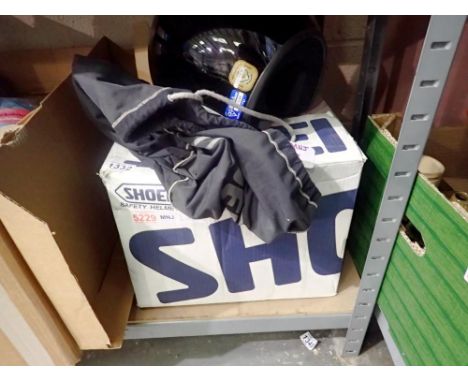 Two motorbike helmets, a black Shoei RJ-Air 2 and a white Shoei TRX. Not available for in-house P&amp;P