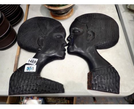 Two Nigerian tribal art wall plaques, H: 34 cm. UK P&amp;P Group 3 (£30+VAT for the first lot and £8+VAT for subsequent lots)