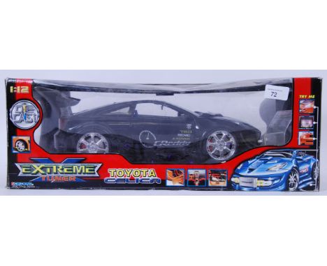 DIECAST: A large scale 1:12 diecast model ' Extreme Tuner ' Toyota Celica model. Original box.