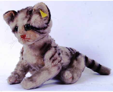 STEIFF: An original vintage 1950's Steiff cat / kitten - with button to ear and tag. 13" long, approx.