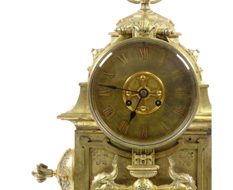 A large 19th century Gothic brass-cased 8-day mantel clock, architectural design case with fleur de lis and cruciform symbols
