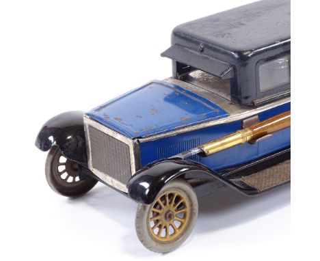 MOTORING INTEREST - a rare tinplate desk stand in the form of a Sedan car, early 20th century, the canopy hinged to enclose a