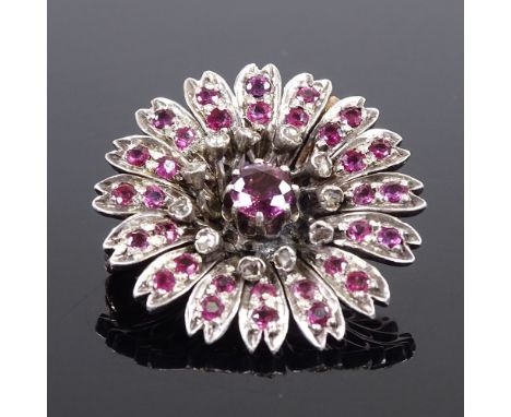 A Victorian unmarked gold ruby and diamond cluster flowerhead brooch, brooch diameter 26.2mm, 8.7gGood overall condition, all