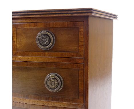 A miniature Edwardian mahogany serpentine-front apprentice chest of drawers, with inlaid cross-banding and splay bracket feet