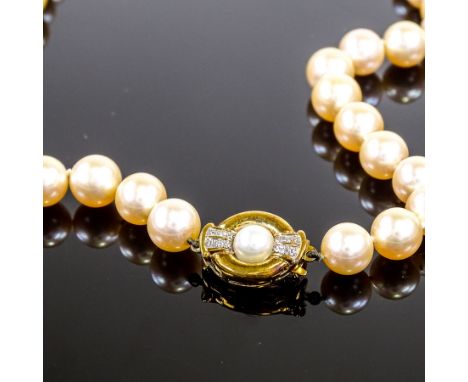 A single strand freshwater pearl Princess necklace, with 9ct pearl and diamond set clasp, necklace length 18", 47.4gVery good