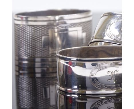 A pair of Edwardian silver napkin rings, by James Dixon & Sons Ltd, hallmarks Sheffield 1907, cased, and an Art Deco silver e