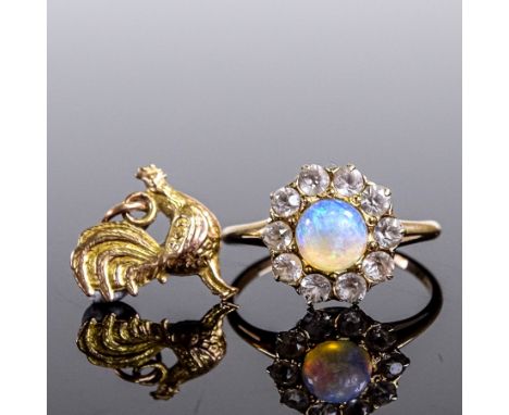 An unmarked gold cabochon opal and white sapphire cluster dress ring, setting height 11.7mm, size L, and a 9ct gold cockerel 