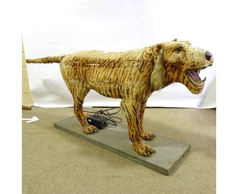 A full size automaton tiger, probably early to mid-20th century, electric powered with moving head and tail, overall length 2
