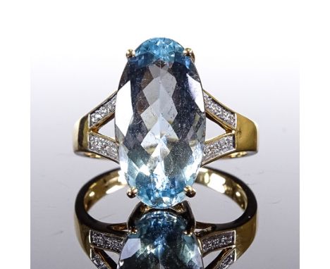 An 18ct gold aquamarine and diamond dress ring, oval-cut aqua approx 6ct, setting height 16.3mm, size Q/R, 5.8gVery good orig
