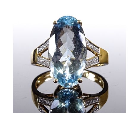 An 18ct gold aquamarine and diamond dress ring, oval-cut aqua approx 6ct, setting height 16.3mm, size Q/R, 5.8gVery good orig