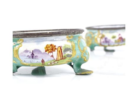 A pair of Battersea enamel circular salts, circa 1760, diameter 6.5cm2 feet damaged on each salt, otherwise good condition 