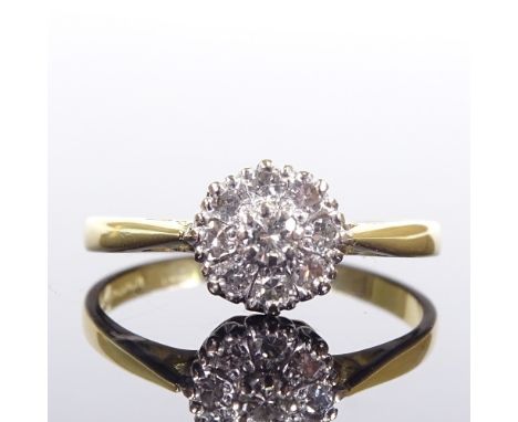 An 18ct gold diamond cluster flowerhead dress ring, total diamond content approx 0.2ct, setting height 8mm, size P, 2.7gVery 