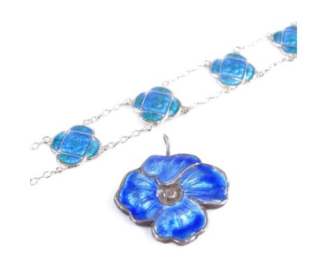 An Arts and Crafts sterling silver and blue enamel panel bracelet, and a Continental silver and enamel floral pendant, bracel